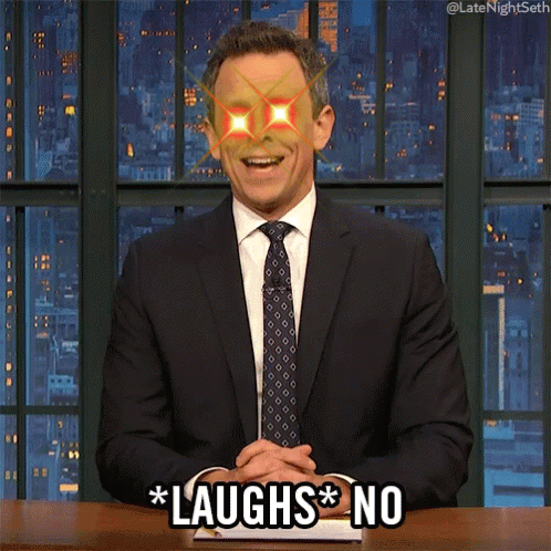 Man In Suit Saying Laughs No At Desk GIF