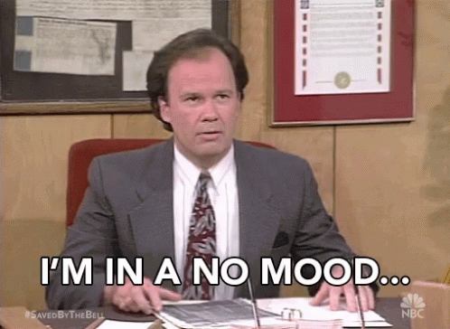 Man In Suit And Tie Sitting At Desk I M In A No Mood GIF