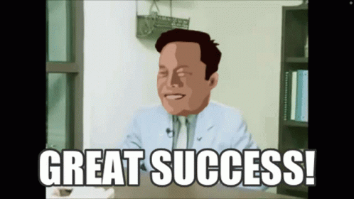 A Man In A Suit And Tie Is Sitting At A Desk With The Words Great Success Below Him GIF