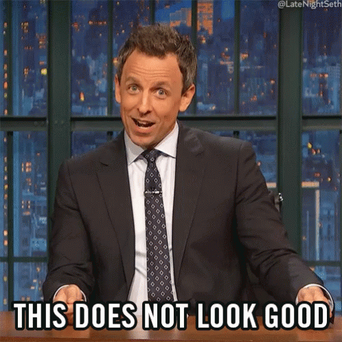 A Man In A Suit And Tie Is Sitting At A Table And Says This Does Not Look Good GIF
