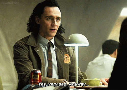 A Man In A Suit And Tie Is Sitting At A Table With A Can Of Soda And Says Yes Very Sad Anyway .. GIF