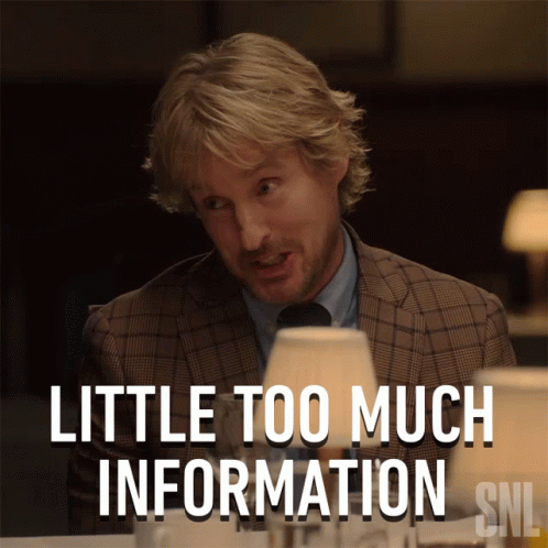 A Man In A Suit And Tie Is Sitting At A Table With The Caption Little Too Much Information Snl GIF