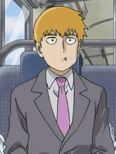 A Man In A Suit And Tie Is Sitting In A Bus GIF