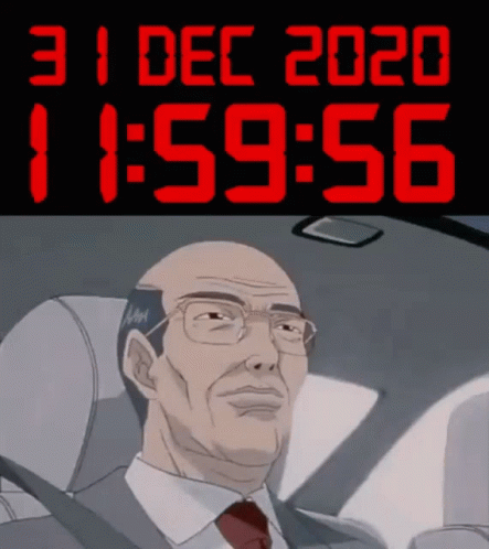 A Man In A Suit And Tie Is Sitting In A Car Under A Digital Clock That Says 11:59 GIF