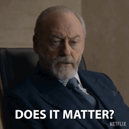 Man In Suit Sitting And Saying Does It Matter GIF