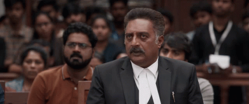 Man In Suit And Tie Speaking To Crowd GIF