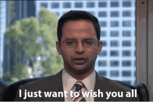 A Man In A Suit And Tie Is Sitting In Front Of A Window And Says " I Just Want To Wish You All " GIF