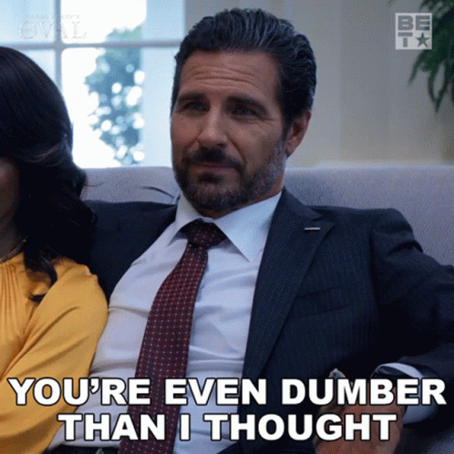 A Man In A Suit And Tie Is Sitting Next To A Woman And Says " You 'Re Even Dumber Than I Thought " GIF