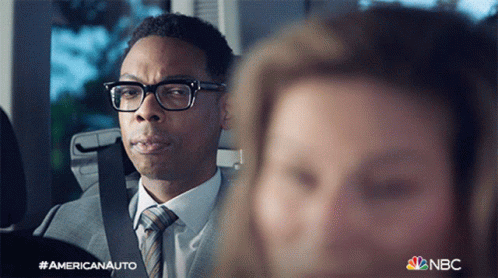 Man In Suit And Tie Next To Woman In Car NBC Logo GIF