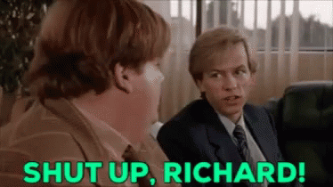 A Man In A Suit And Tie Is Sitting Next To Another Man In A Chair And Says `` Shut Up , Richard '' . GIF