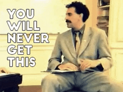 A Man In A Suit And Tie Is Sitting On A Chair With The Words `` You Will Never Get This '' Behind Him . GIF