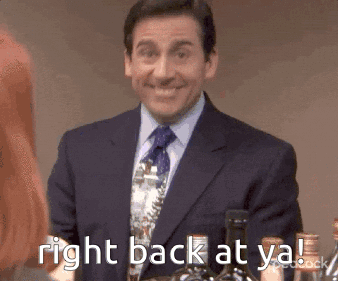 A Man In A Suit And Tie Is Smiling And Holding A Bottle Of Wine . GIF