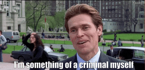 A Man In A Suit And Tie Is Smiling And Saying I 'M Something Of A Criminal Myself GIF