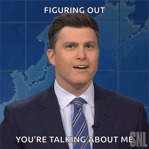 A Man In A Suit And Tie Is Smiling And Says " Figuring Out You 'Re Talking About Me " GIF