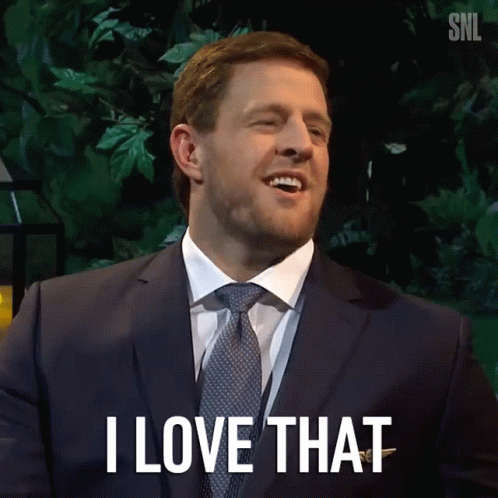 A Man In A Suit And Tie Is Smiling And Says I Love That GIF