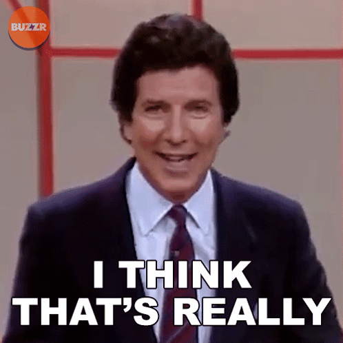 A Man In A Suit And Tie Is Smiling And Says I Think That 'S Really GIF