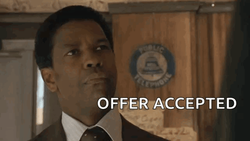 Smiling Man In Suit And Tie Says Offer Accepted GIF