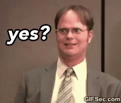 a man in a suit and tie is smiling and says yes .