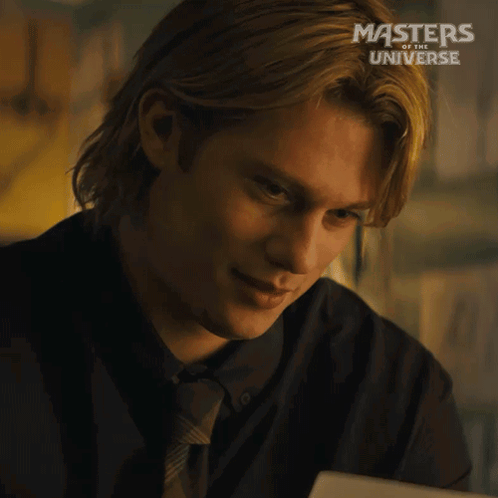 A Man In A Suit And Tie Is Smiling In A Masters Of The Universe Advertisement GIF