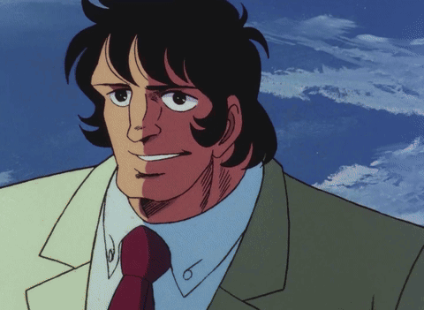 Smiling Man In Suit And Tie In Front Of Clouds GIF