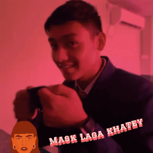 A Man In A Suit And Tie Is Smiling In Front Of A Pink Background That Says " Mask Laga Khaley " GIF