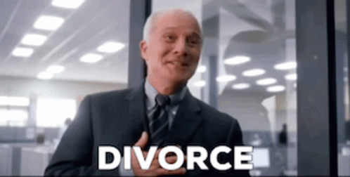 A Man In A Suit And Tie Is Smiling In Front Of A Window With The Word Divorce Written On It . GIF