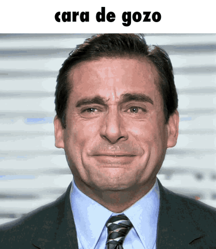 A Man In A Suit And Tie Is Smiling With The Caption Cara De Gozo GIF