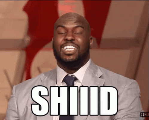 A Man In A Suit And Tie Is Smiling With The Word Shiid On His Face GIF