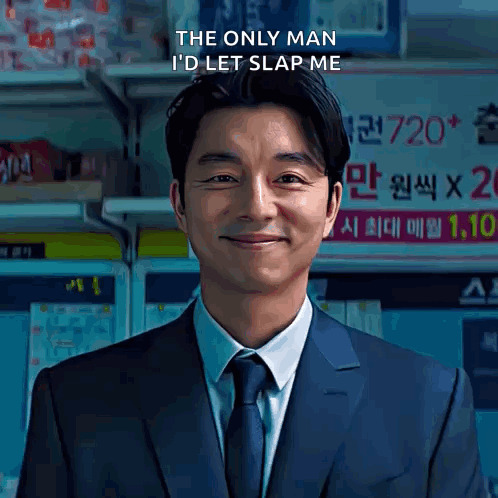 A Man In A Suit And Tie Is Smiling With The Words The Only Man I 'D Let Slap Me Above Him GIF