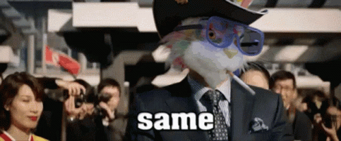 A Man In A Suit And Tie Is Smoking A Cigarette And Wearing A Hat And Sunglasses With The Word Same Written On It GIF