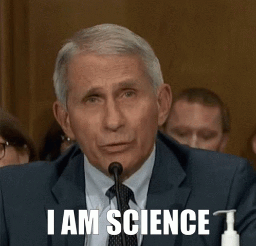 A Man In A Suit And Tie Is Speaking Into A Microphone And Says " I Am Science " GIF