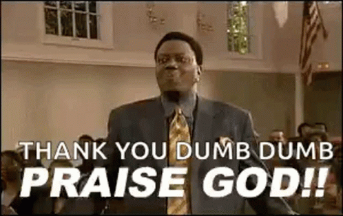 A Man In A Suit And Tie Is Standing In A Church And Saying `` Thank You Dumb Dumb Praise God '' . GIF