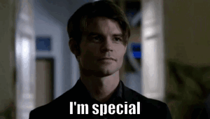 A Man In A Suit And Tie Is Standing In A Hallway And Saying `` I 'M Special '' . GIF