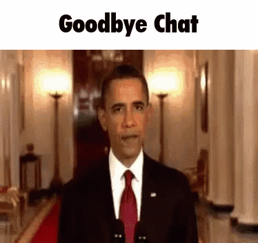 A Man In A Suit And Tie Is Standing In A Hallway And Says Goodbye Chat GIF