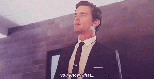a man in a suit and tie is standing in a room and saying `` you know what ... ''