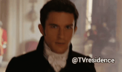 A Man In A Suit And Tie Is Standing In A Room With A Caption That Says Tvresidence GIF