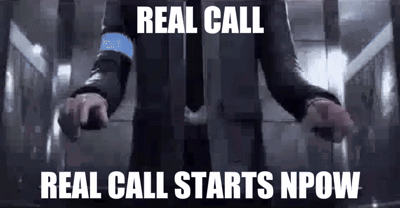a man in a suit and tie is standing in an elevator with his arms outstretched and the words `` real call '' .