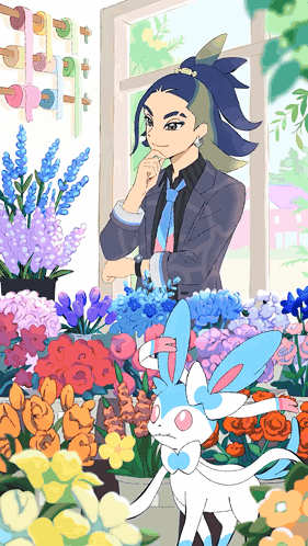 a man in a suit and tie is standing in front of a bunch of flowers