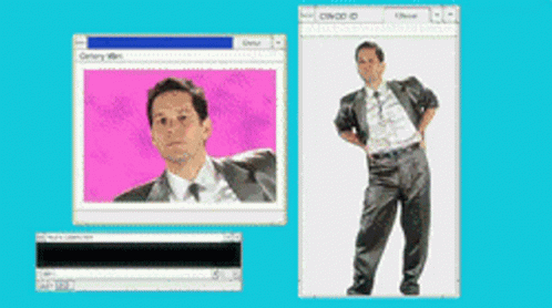 A Man In A Suit And Tie Is Standing In Front Of A Computer Screen GIF