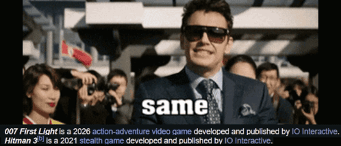 A Man In A Suit And Tie Is Standing In Front Of A Crowd Of People With The Word Same Written Below Him GIF