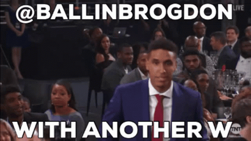 A Man In A Suit And Tie Is Standing In Front Of A Crowd With Another W Written On The Bottom GIF