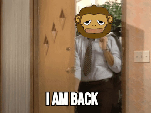 A Man In A Suit And Tie Is Standing In Front Of A Door With A Monkey On His Head That Says I Am Back GIF