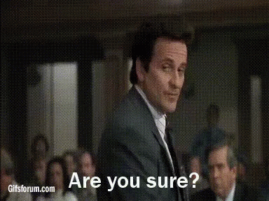 A Man In A Suit And Tie Is Standing In Front Of A Group Of People And Asking If They Are Sure . GIF