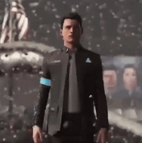 A Man In A Suit And Tie Is Standing In Front Of A Group Of People GIF