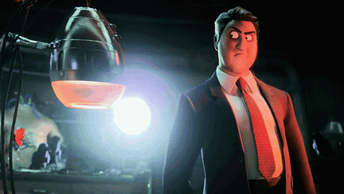 A Man In A Suit And Tie Is Standing In Front Of A Light GIF