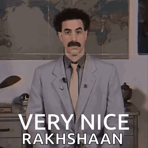 A Man In A Suit And Tie Is Standing In Front Of A Map And Says Very Nice Rakhshaan GIF