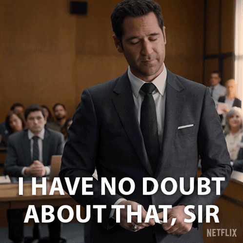 A Man In A Suit And Tie Is Standing In Front Of A Netflix Logo GIF