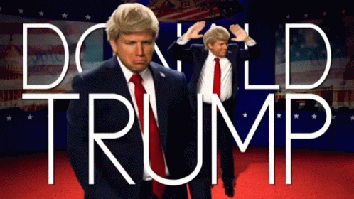 A Man In A Suit And Tie Is Standing In Front Of A Sign That Says Donald Trump GIF