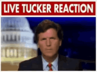 a man in a suit and tie is standing in front of a sign that says " live tucker reaction "