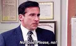 A Man In A Suit And Tie Is Standing In Front Of A Wall And Says No ! God ! Please , No ! GIF